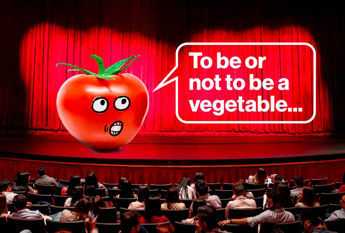 A large tomato is on a stage in front of an audience saying to be or not to be a vegetable.