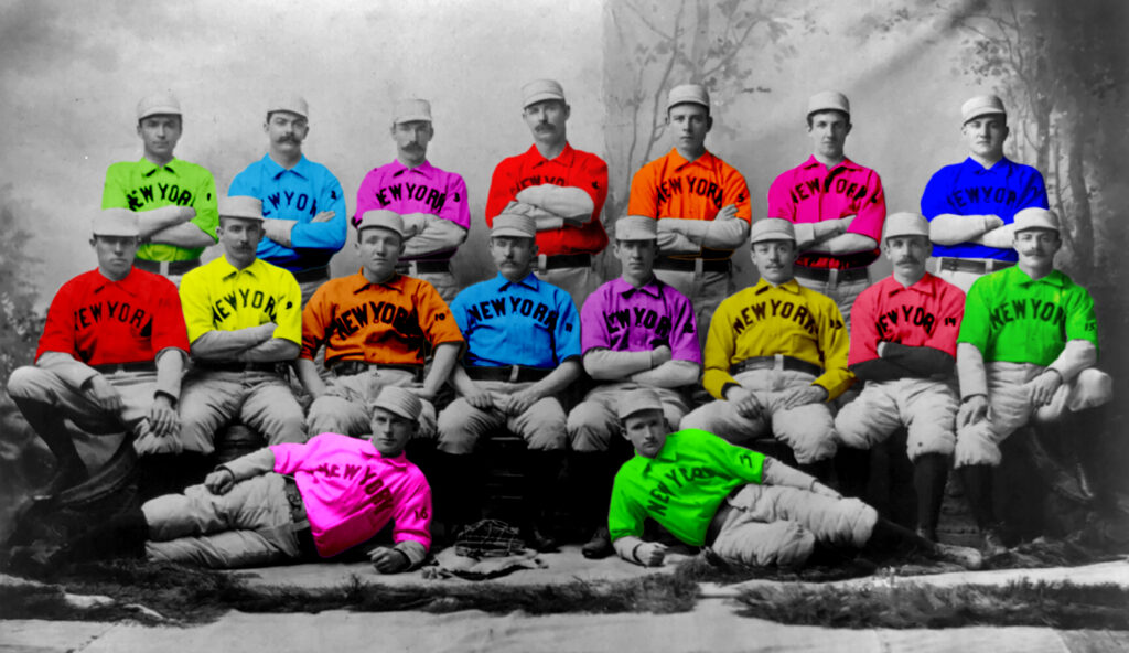 Photo of 19th century baseball team with different color uniform shirts that say New York