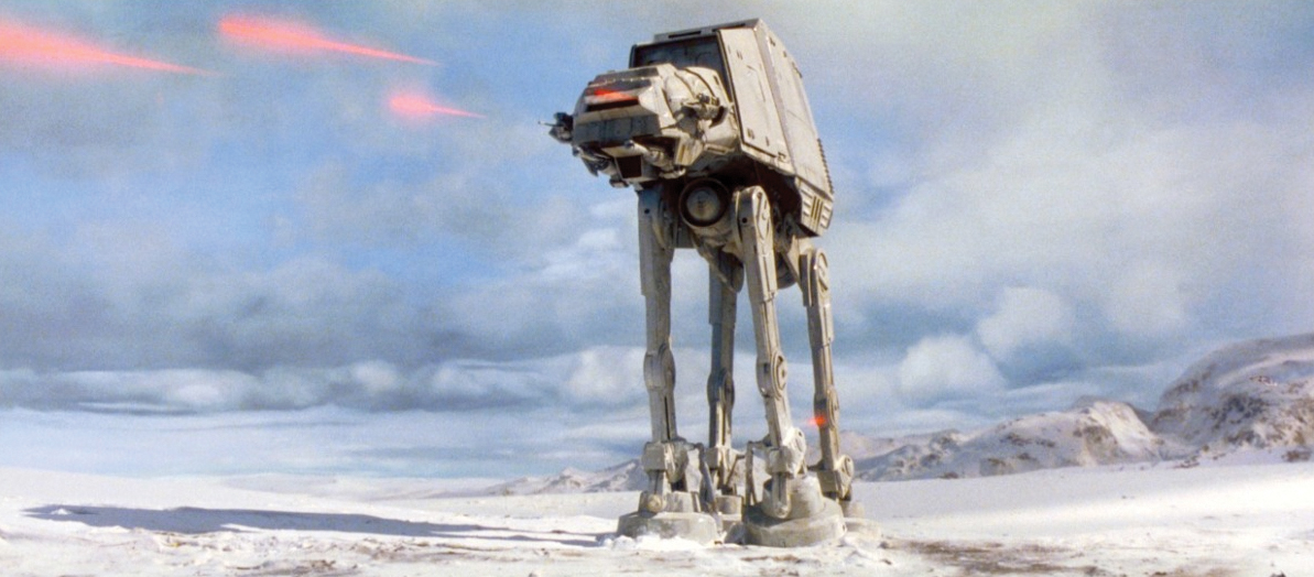 A robotic vehicle with four legs on a barren landscape, shooting lasers.