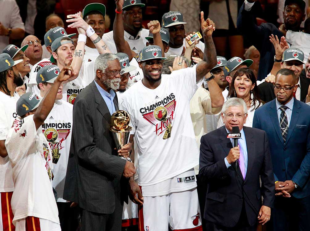 Bill Russell (left) presents the Bill Russell NBA Finals MVP trophy to LeBron James of the Miami Heat in 2012.