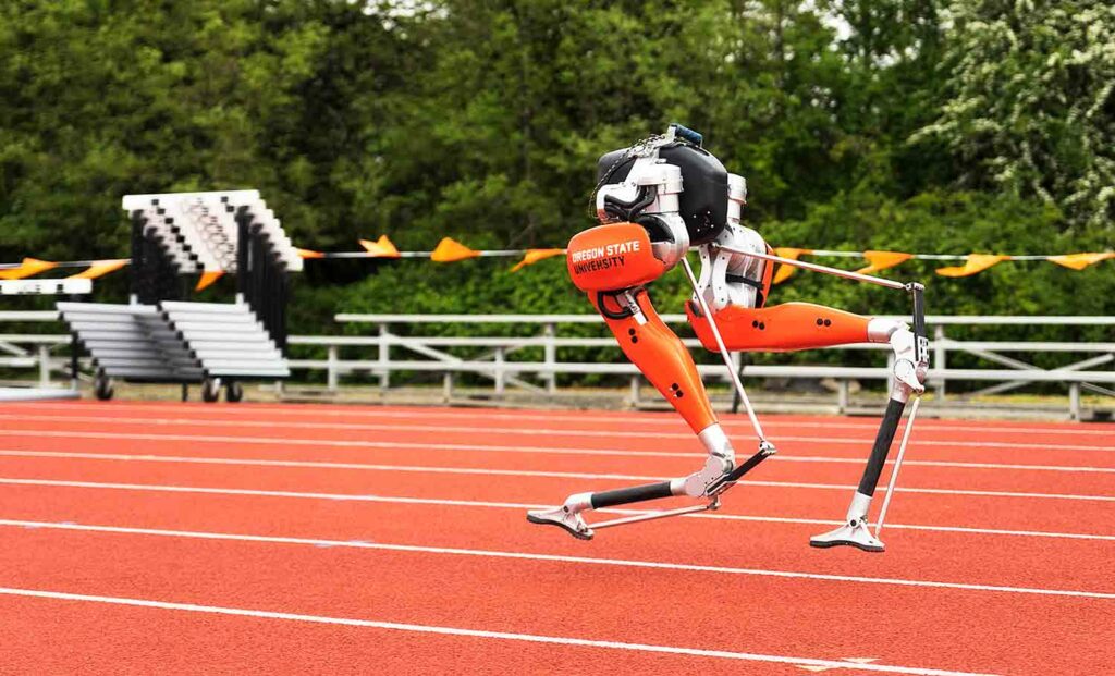 A robot consisting of two legs runs on an outdoor track.