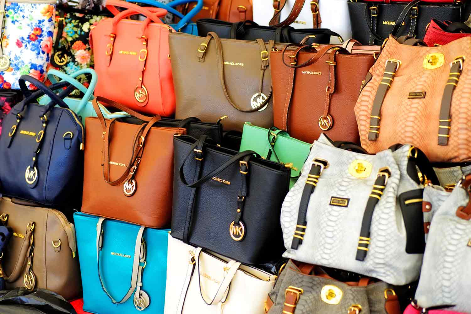 Purses of different colors on display
