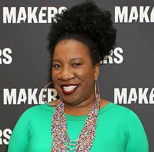 Photo of a smiling Tarana Burke at an event