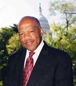 Portrait of John Lewis outdoors with the Capitol Building in the background.