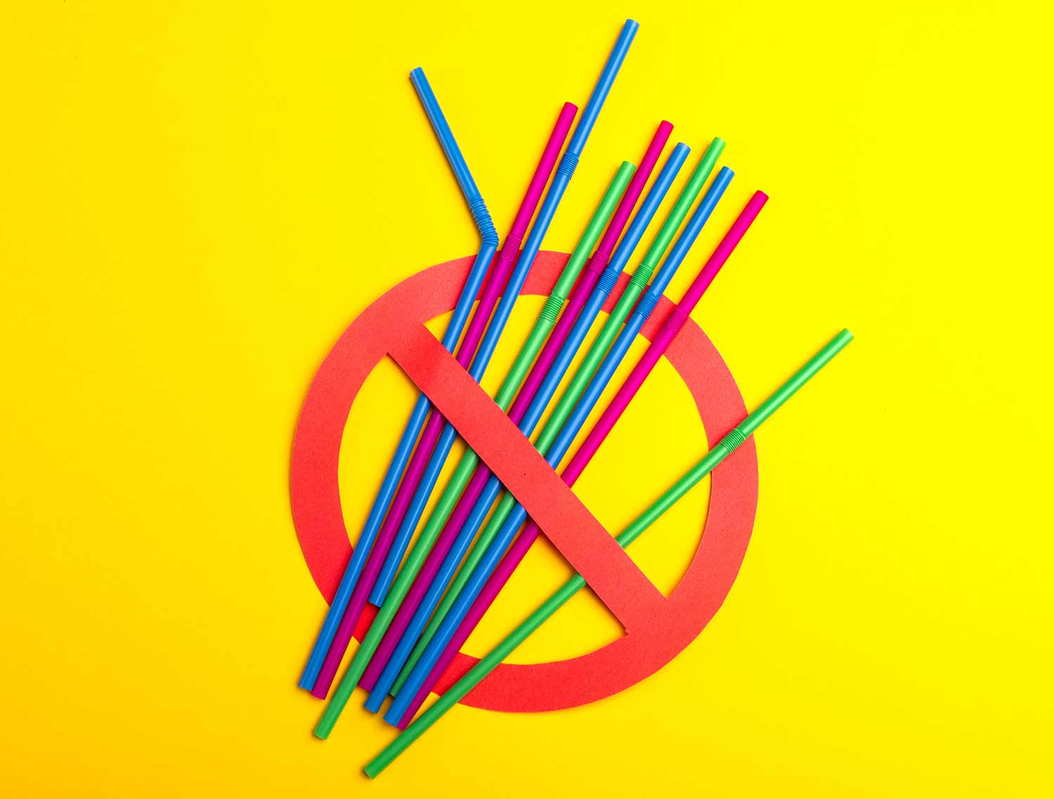 Different colored plastic straws with international symbol for No.