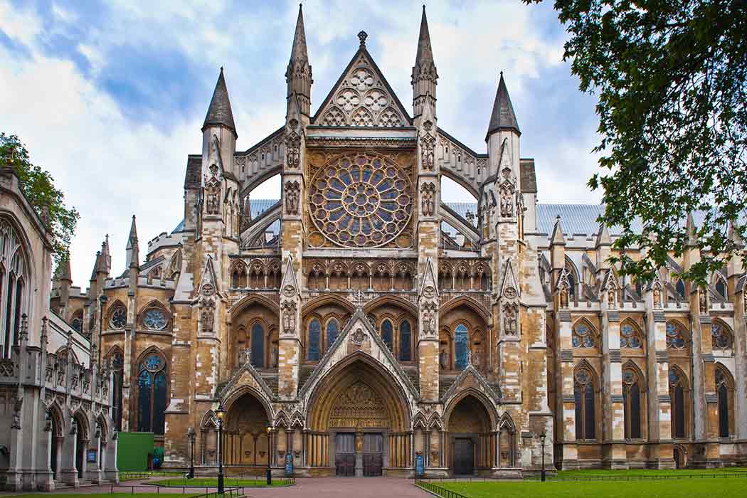 Front of Westminster Abbey, a white and tan building with Gothic features.