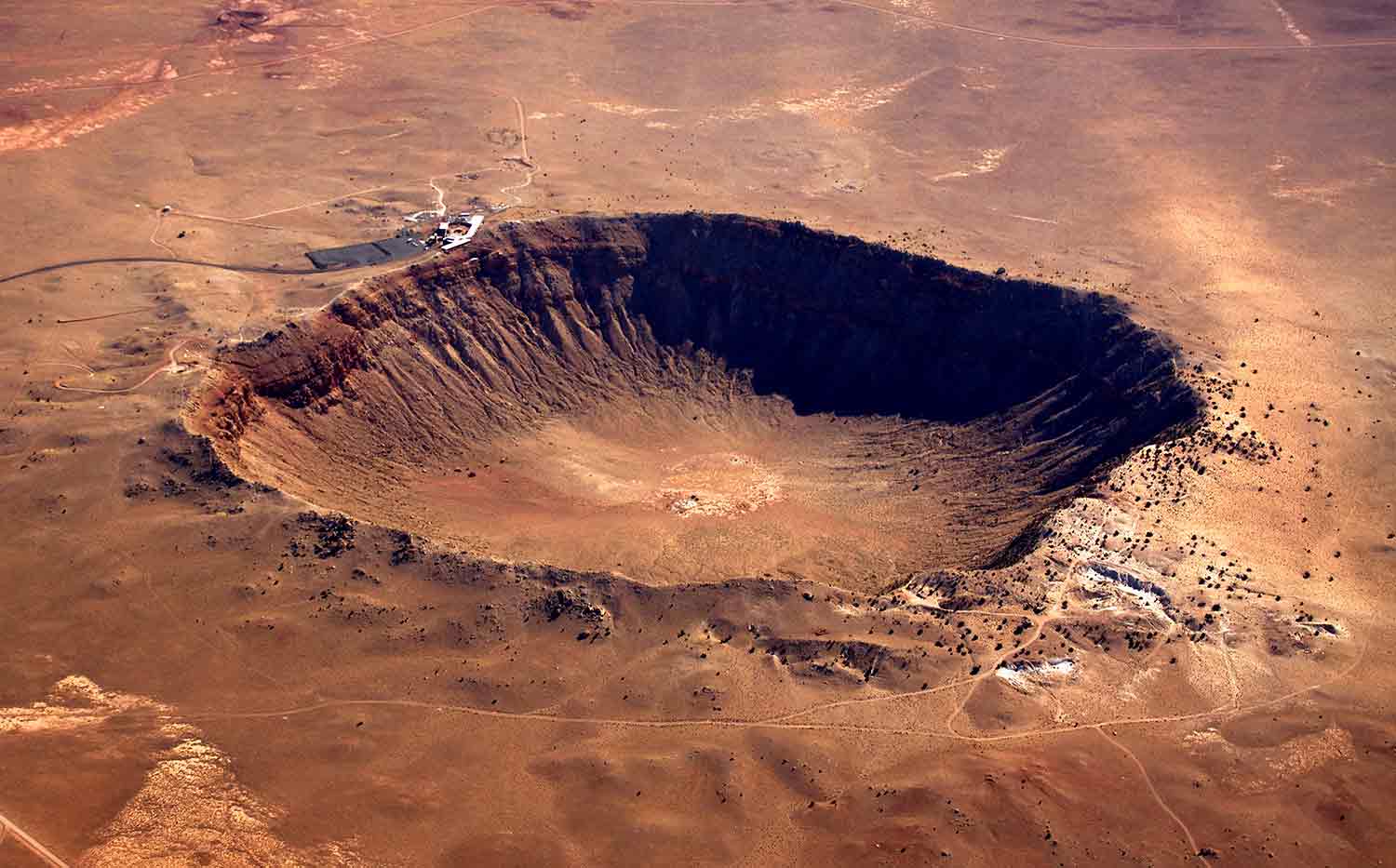 A crater in a brown surface.