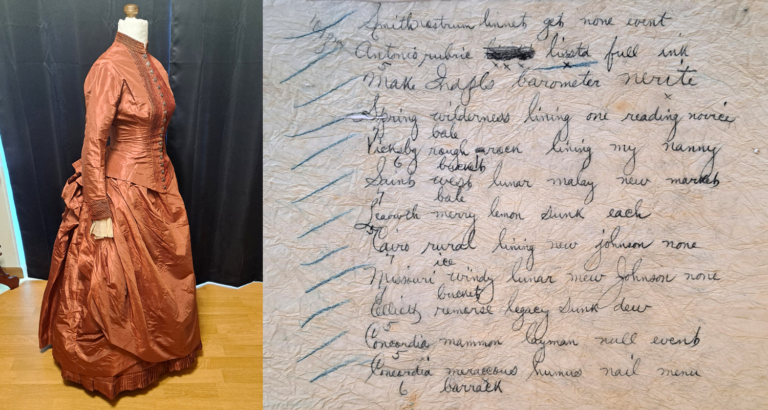A rust-colored, 19th century dress on a mannequin is alongside a wrinkled paper with several handwritten lines.