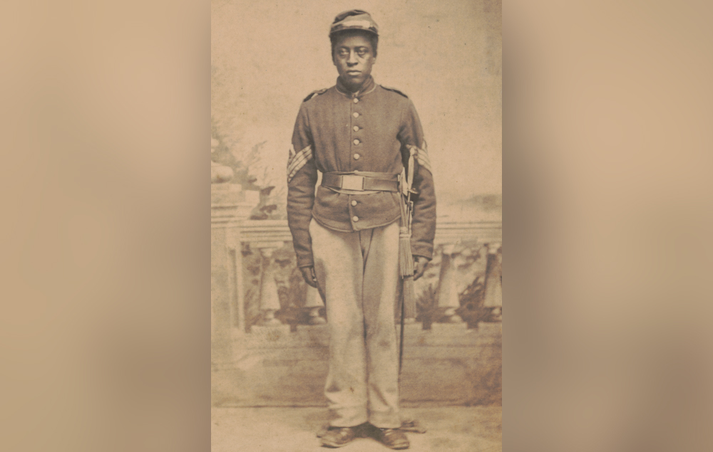 First Sergeant Luther Hubbard poses in a Union army uniform.
