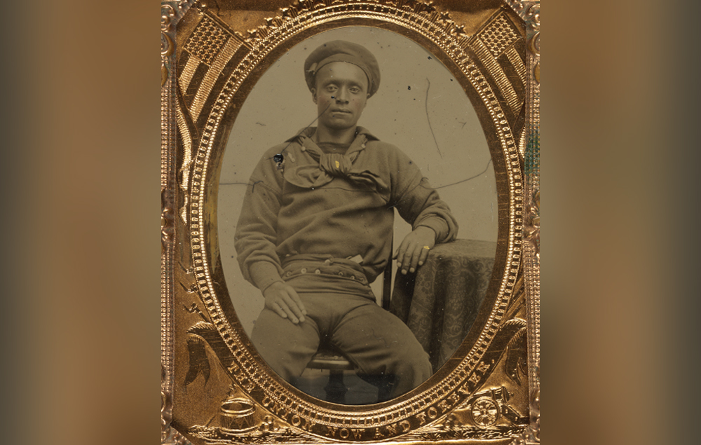 Framed portrait of a seated sailor in Union uniform.