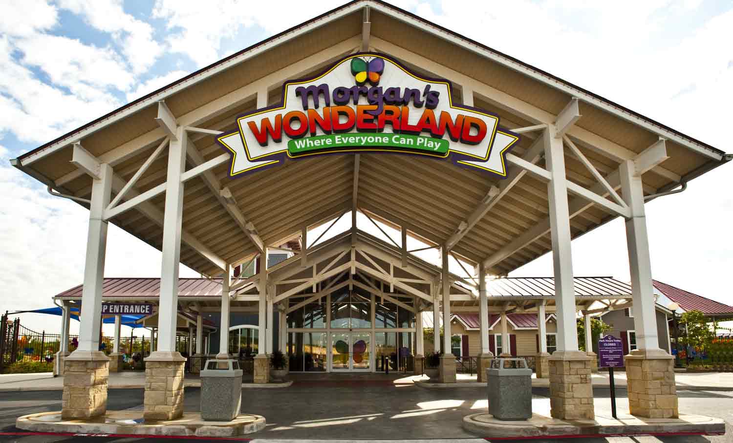 A large atrium leading to a building entrance with a sign reading Morgan’s Wonderland