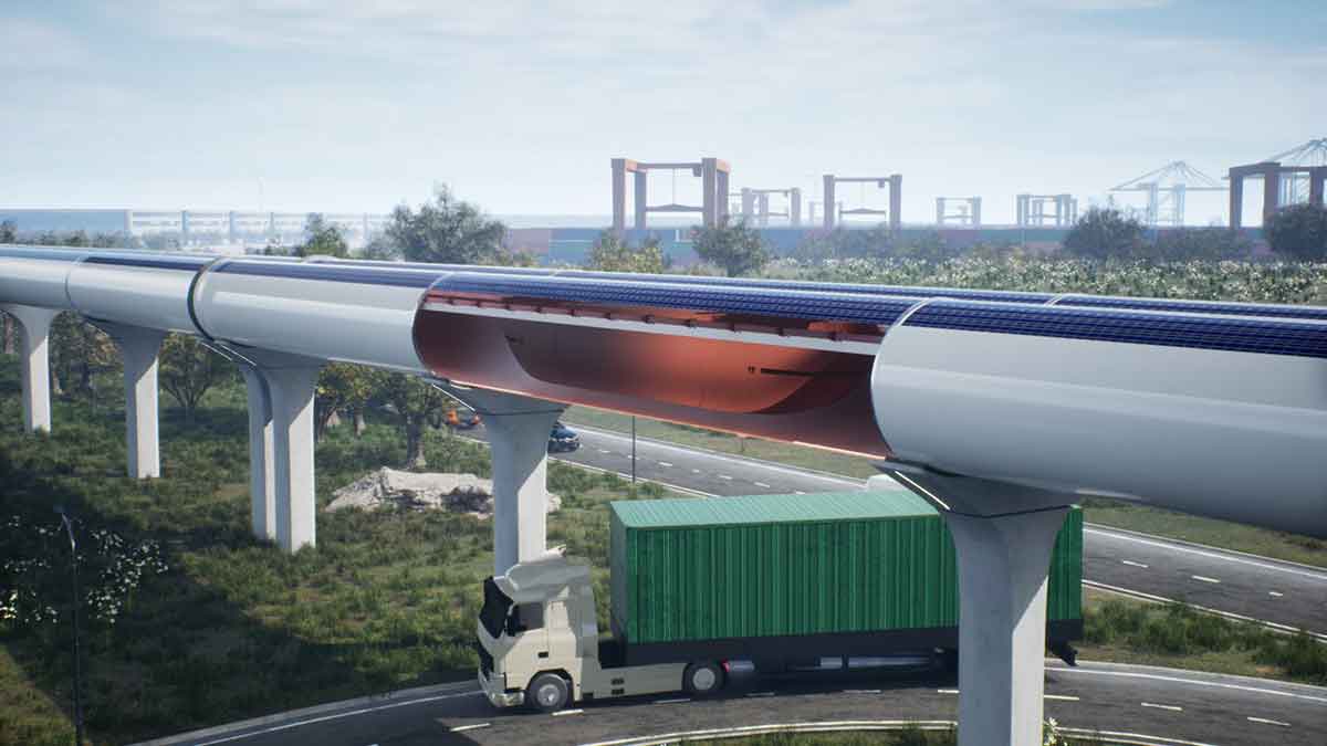 A truck is driven under a hyperloop tube through which a hyperloop pod is visible.