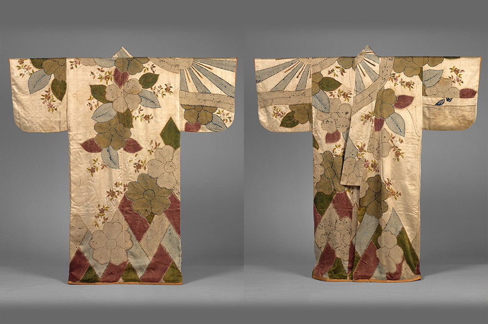 The front and back of a robe decorated with large images of cherry blossoms.