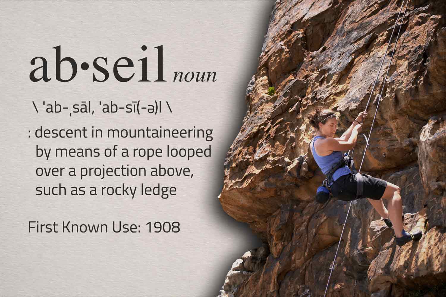 The dictionary definition of abseil is shown next to a photo of a woman abseiling.