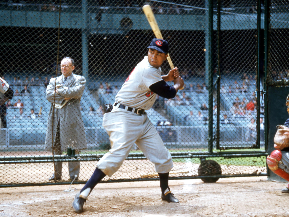 Larry Doby is poised to swing a bat.