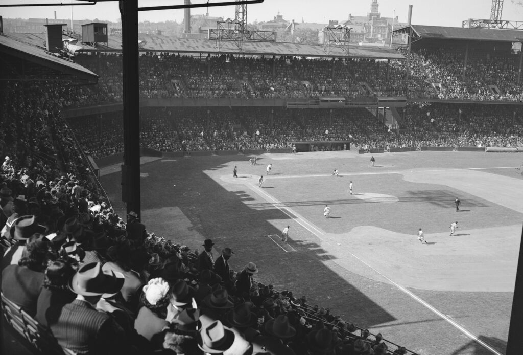 Black and white photo taken from the stands at a baseball game
