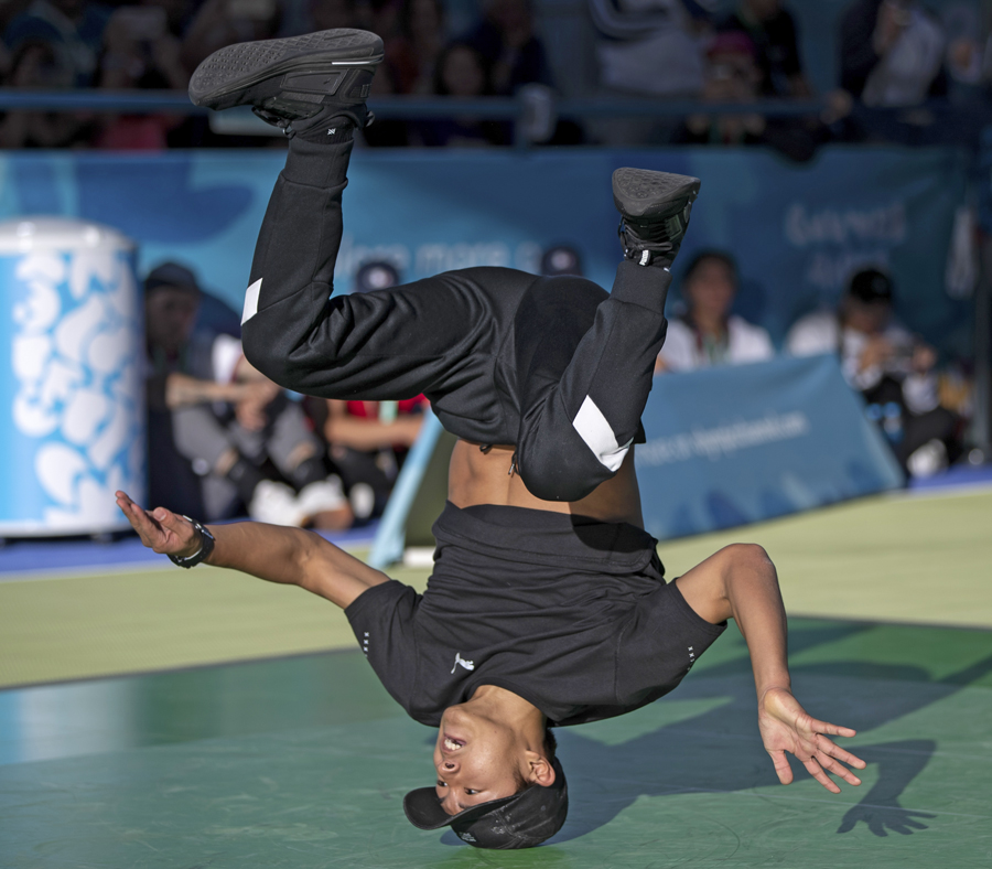 Shigeyuki Nakarai is balanced on his head during a breakdancing competition.