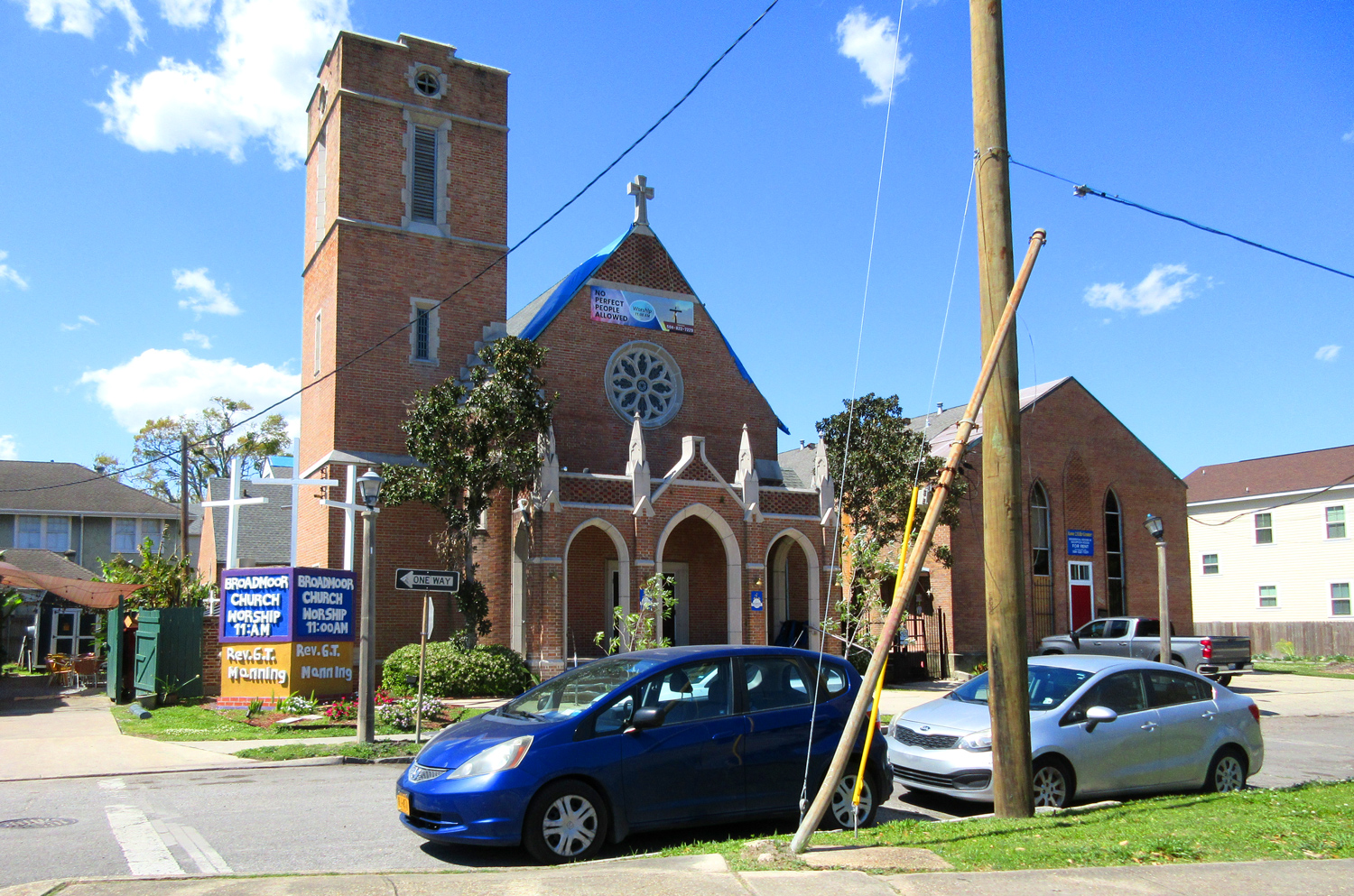 Exterior of a brick church with a sign reading Broadmoor Church.