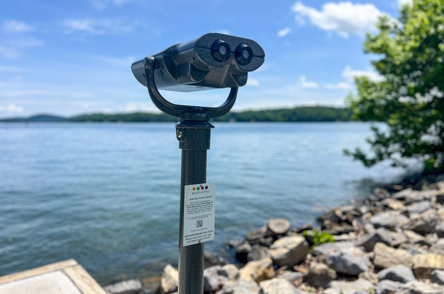 A viewfinder with a lake and hills in the background.