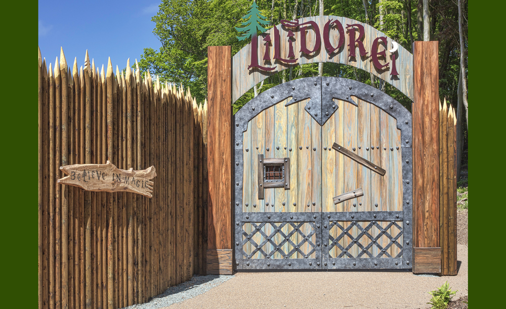 Two large, castle-like wooden doors with a sign that says Lilidorei above.