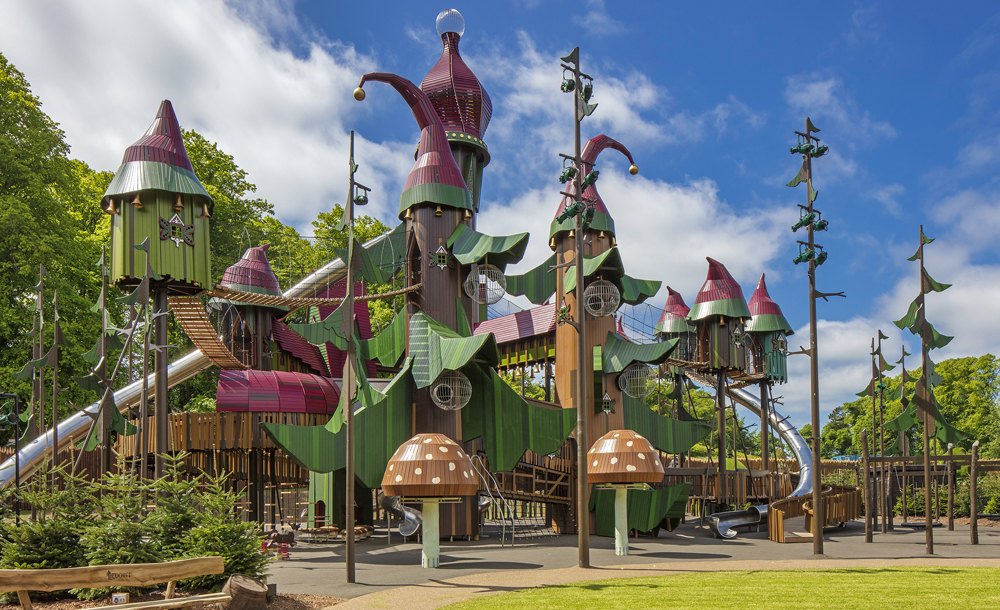 A large play structure with many turrets, bridges, and slides.