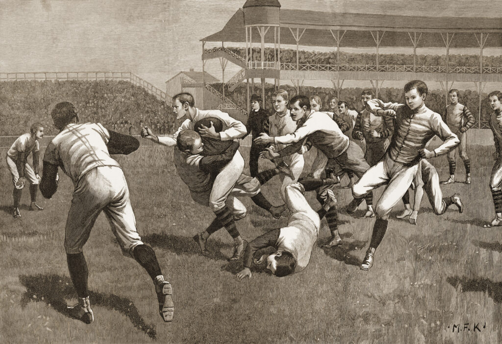 An engraving of an early football game in which the players tackle each other and are not wearing helmets or padding.