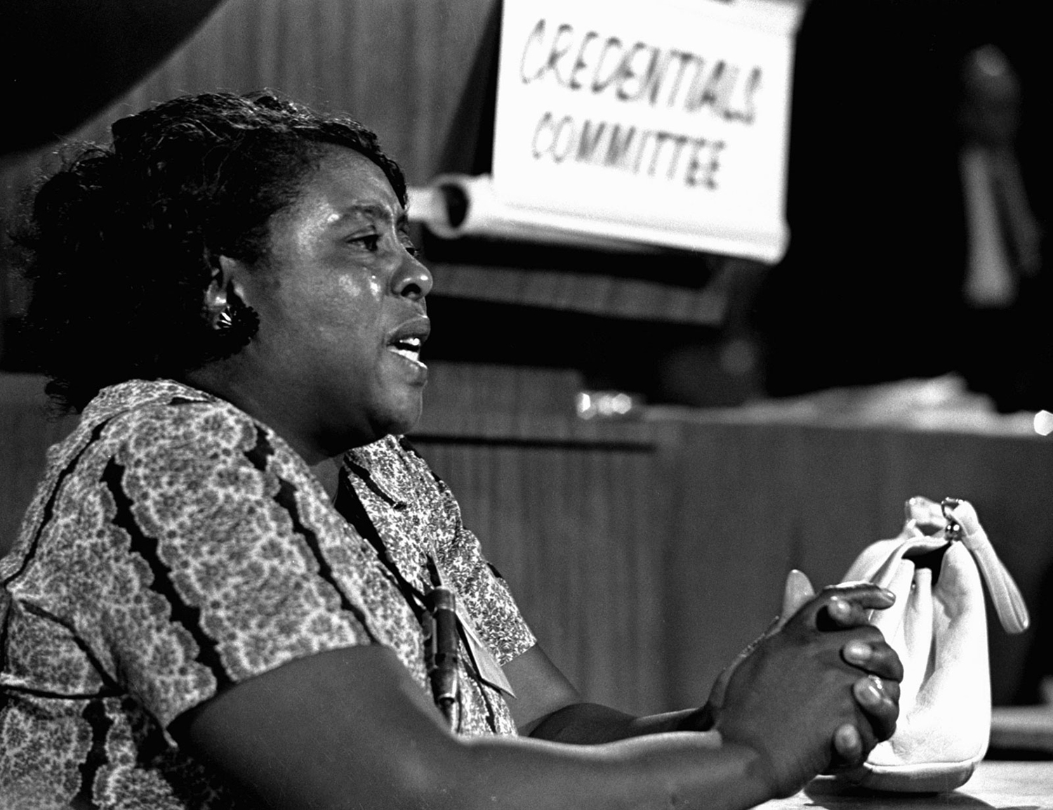 Fannie Lou Hamer sits and speaks to an audience that is off camera.