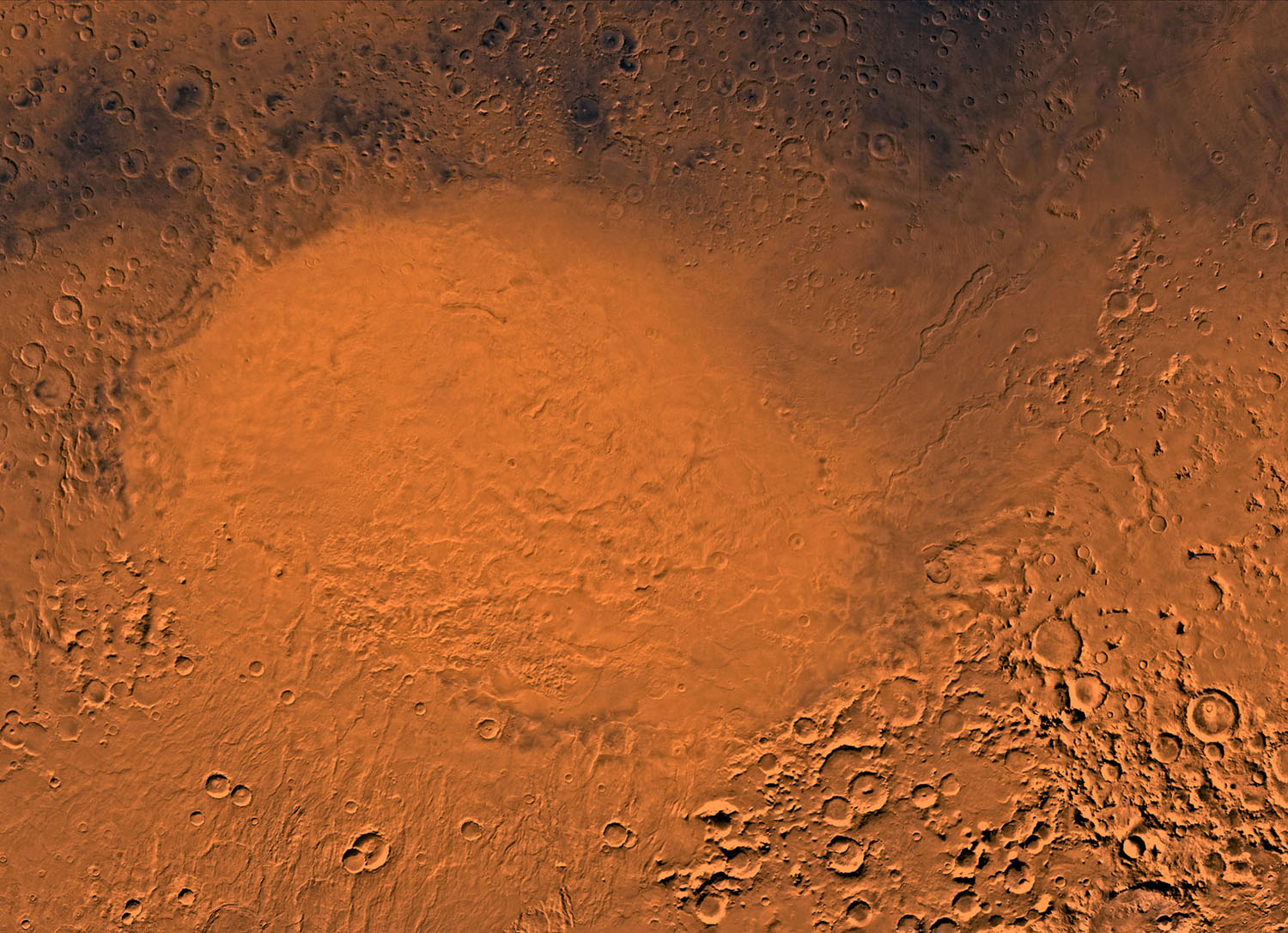 An impact crater on Mars looks bright red.