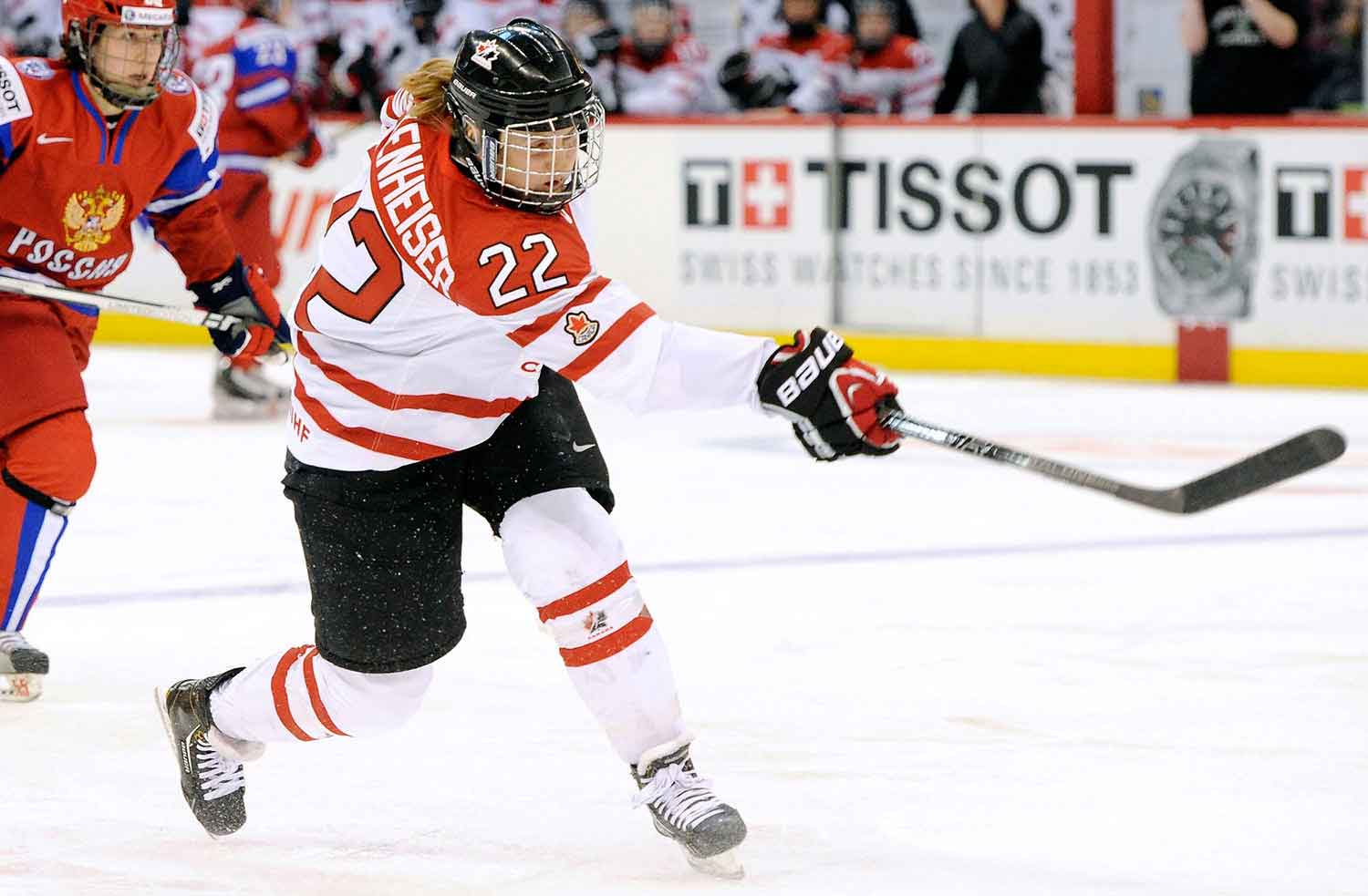 Hayley Wickenheiser waves her stick during a hockey match.