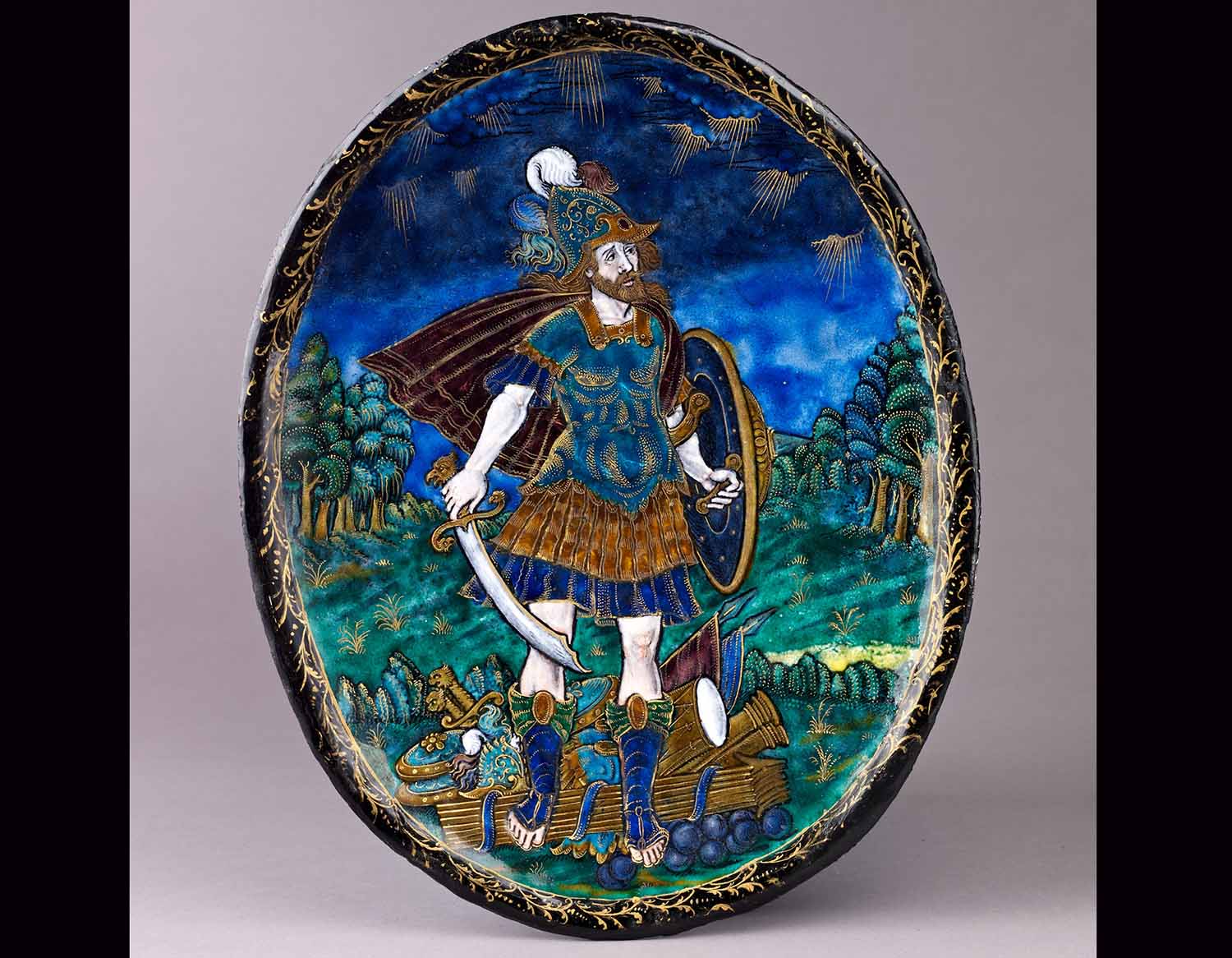 A colorful dish shows the Roman god Mars in Roman military clothing and carrying a sword and shield.