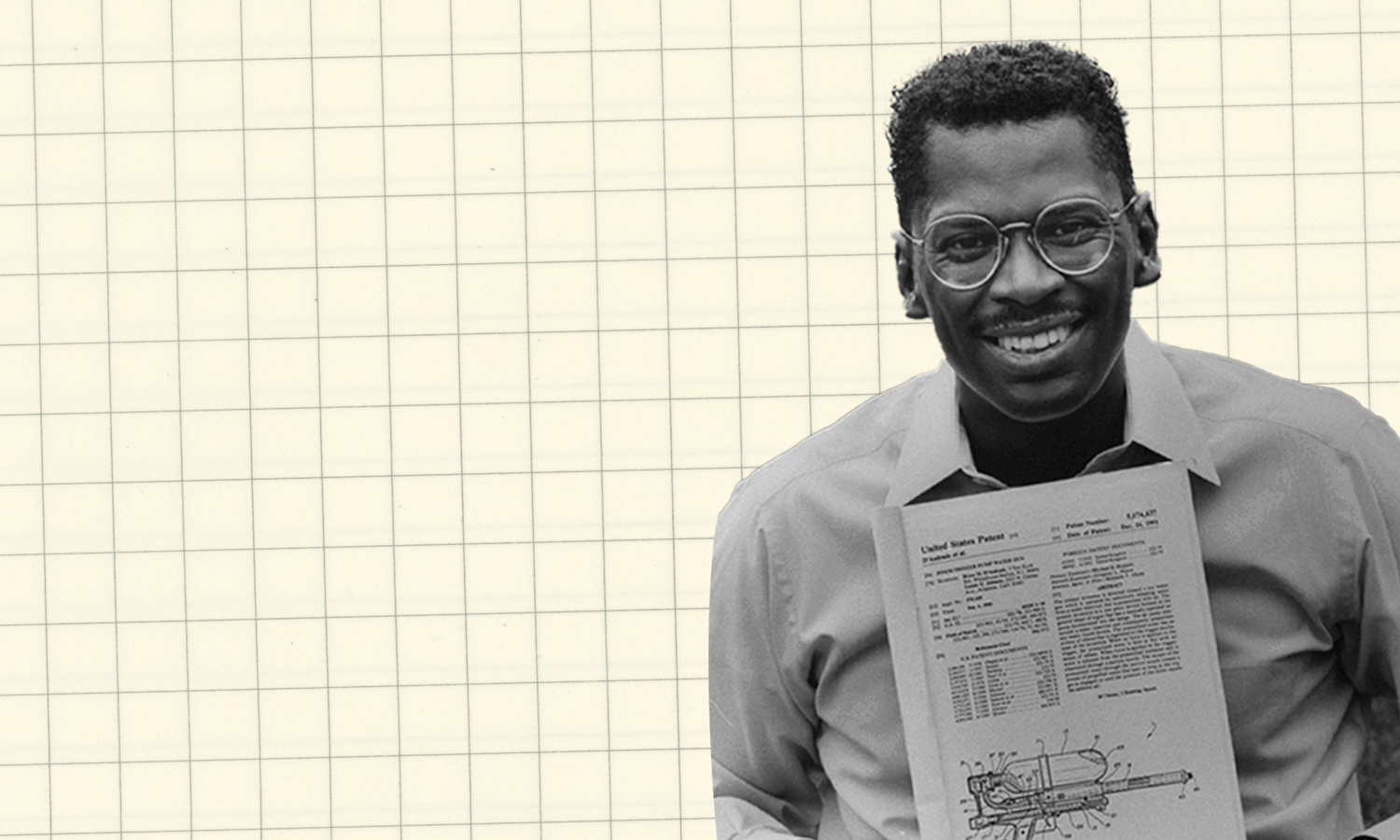 Lonnie Johnson holds his patent as illustrated water drops move in and soak him.