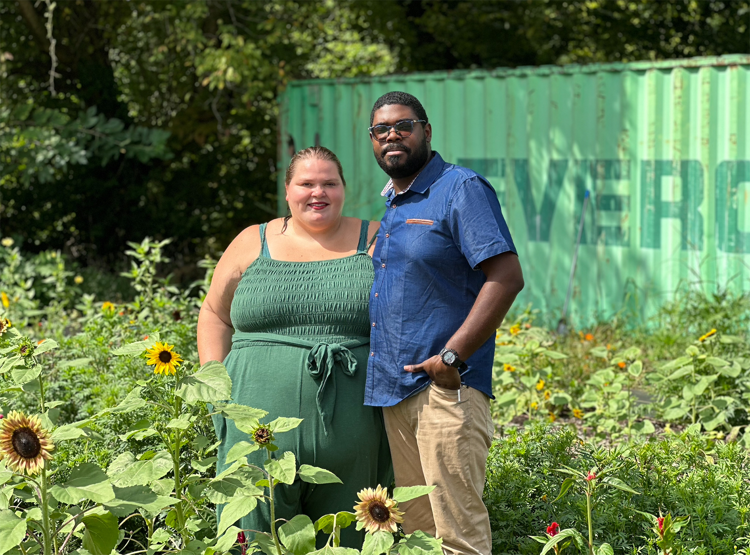 Marisa Mender-Franklin and Corey Franklin pose together in an outdoor setting.