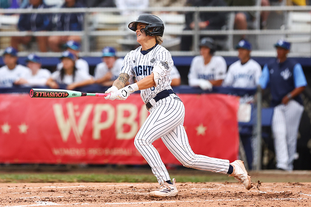Denae Benites is about to drop the bat and run after having just hit.