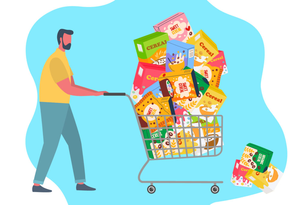A man pushes a shopping cart that is filled with boxes of cereal.
