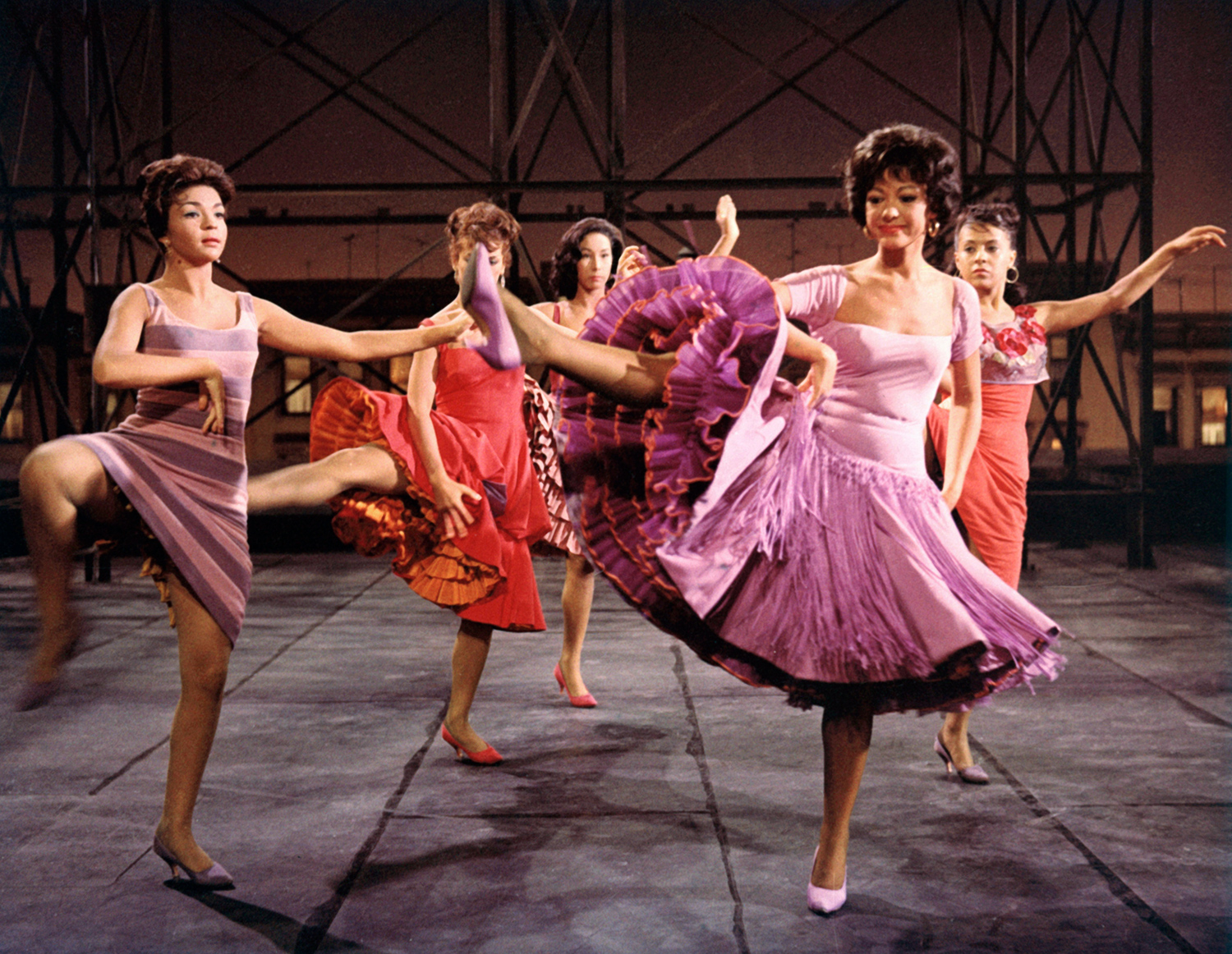 Rita Morena and several other women perform a dance from West Side Story.